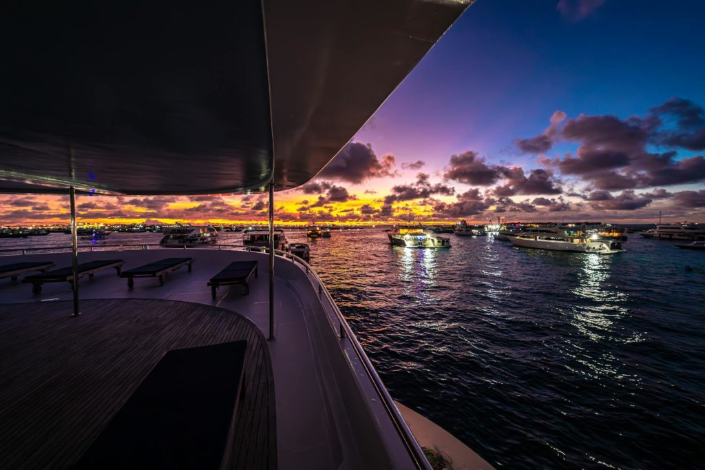 luxury yacht at sunset in the maldives