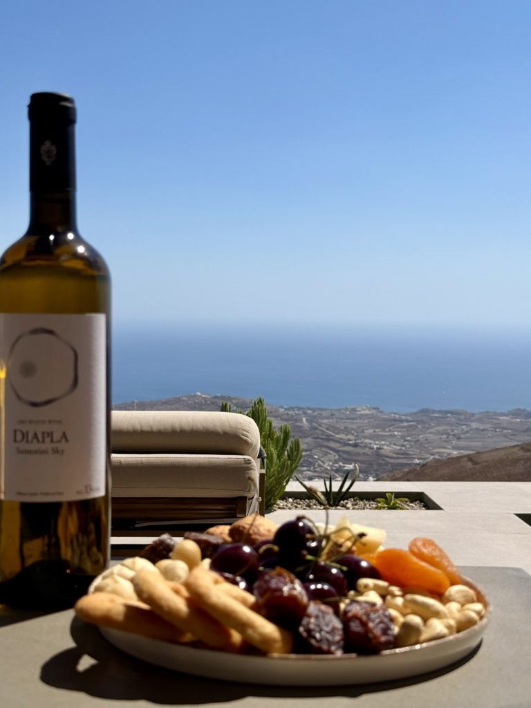 Santorini Sky Check-in | Terrace, fruit and wine | The Inclusive Edit