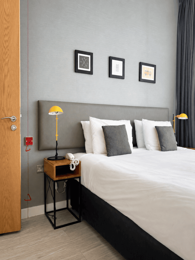 Spacious double bedroom in the two-bedroom apartment at Staycity Manchester Piccadilly, with large window and clear circulation space.