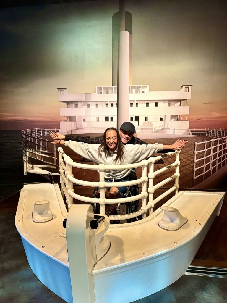 Luiz Faye posing at a ship display inside Titanic Belfast.